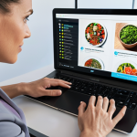 **A nutrition coach in a modern health tech office, using technology to create personalized nutrition plans for clients.** (Focus: technology, personalization, modern setting)